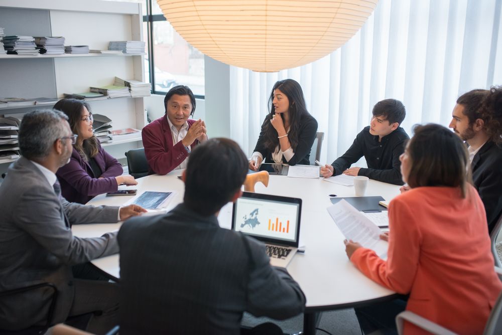 Team running a working session in a meeting room, photo by Kampus Production on Pexels