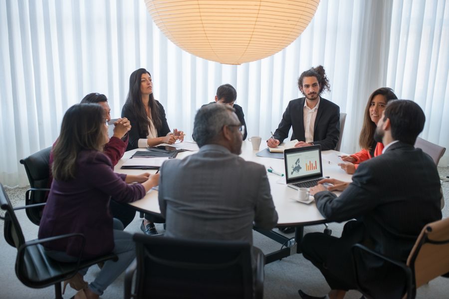 European startup team discussing strategy in a modern office