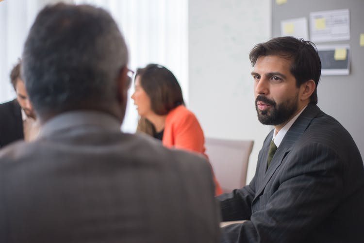 A Group Of People Having A Meeting In The Office