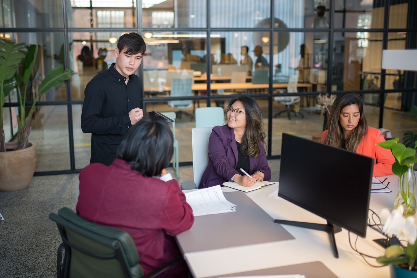 Team meeting in a modern office, photo by Kampus Production on Pexels