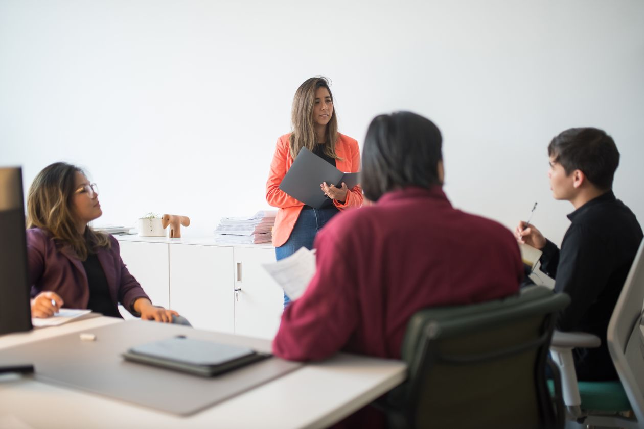 Diverse team engaged in a collaborative business meeting in a modern office