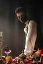 A Man in Medieval Clothes Wearing a Face Mask