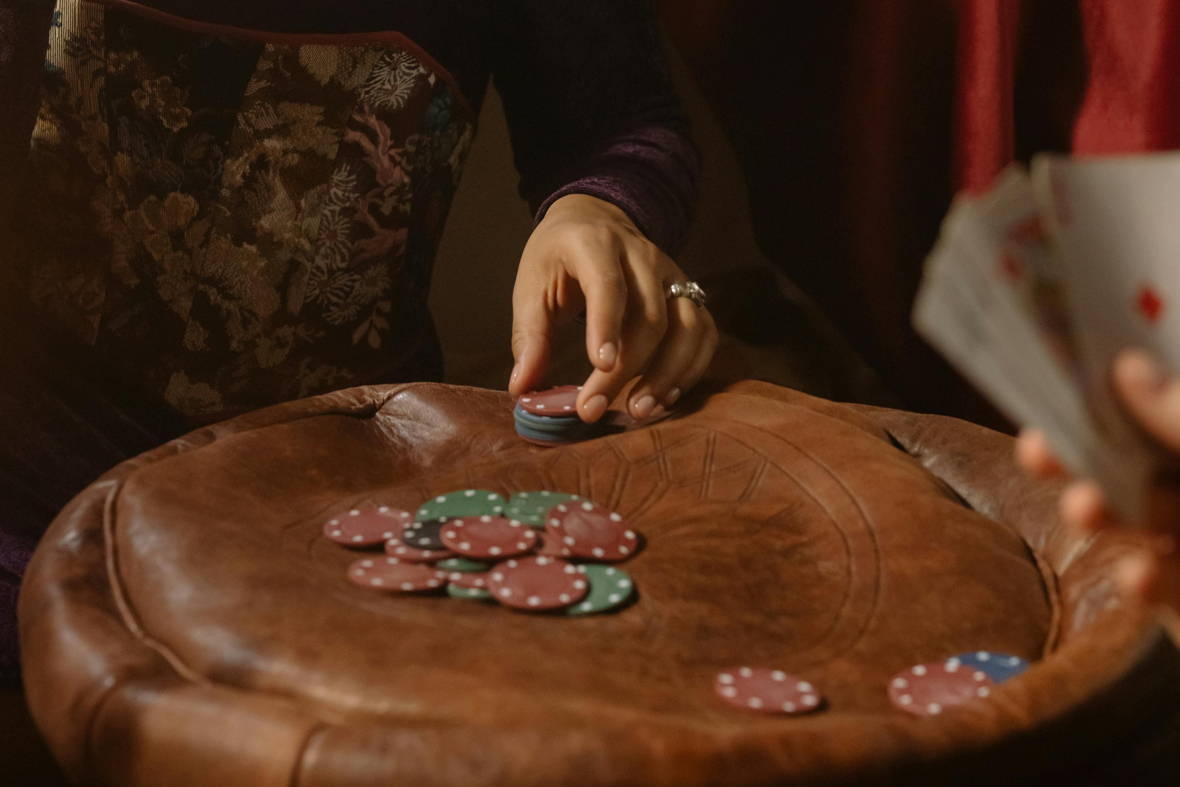 person holding gaming chips