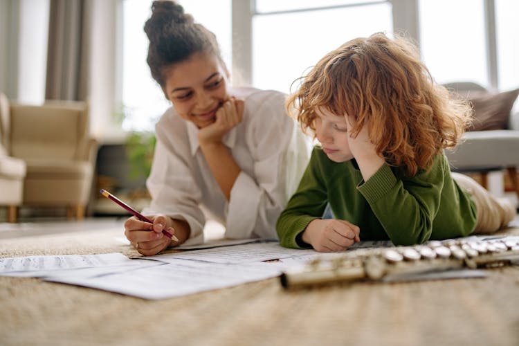 Woman And Child Studying Together