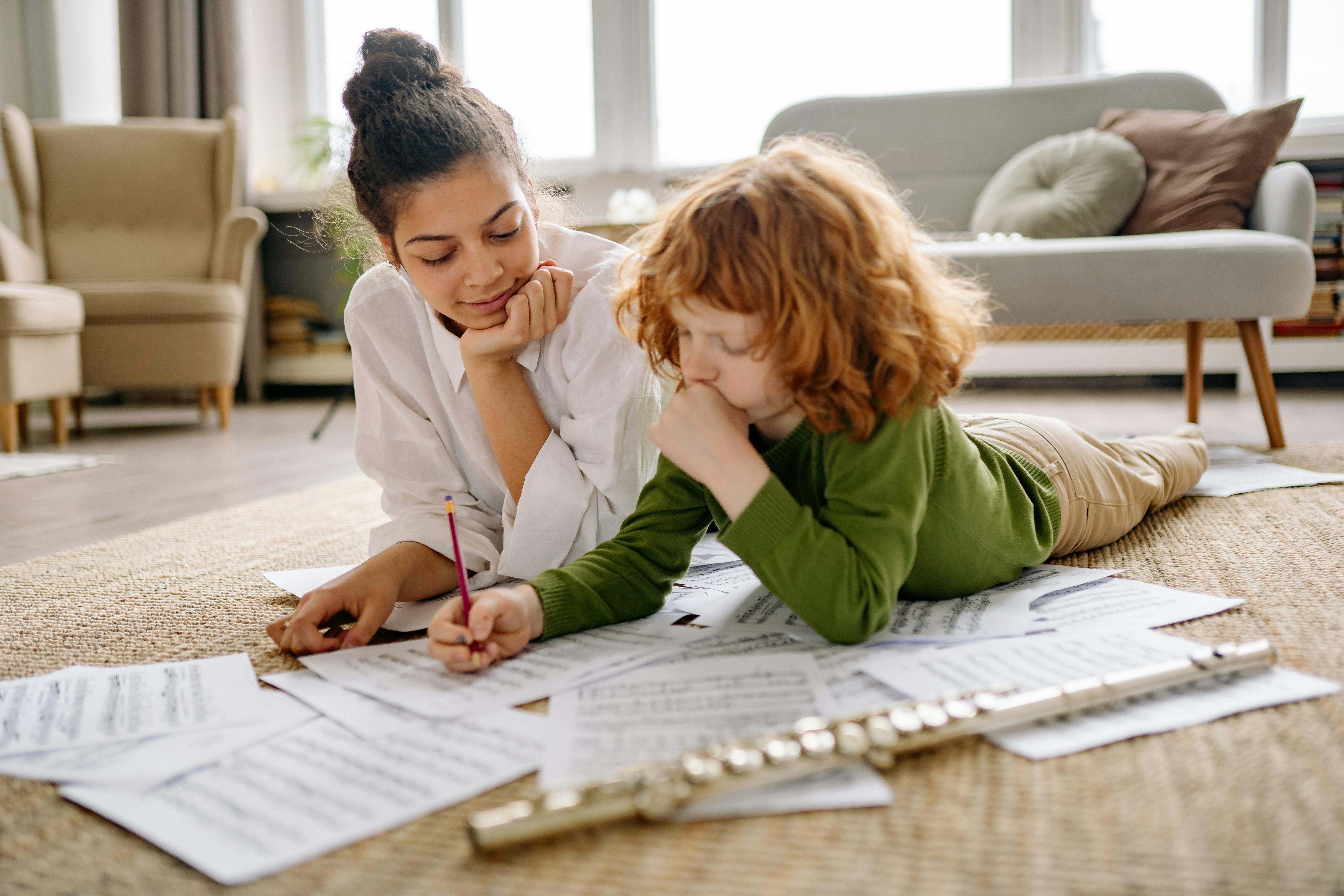A mother and child study music sheets together at home with a flute. Warm and educational setting.