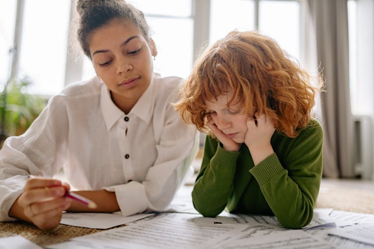 Music Teacher Teaching A Young Boy