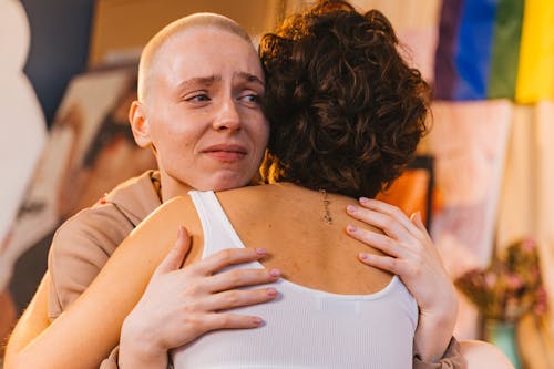Free Woman Hugging Another Sad Woman Stock Photo
