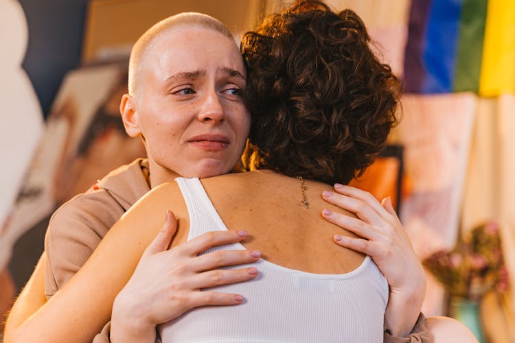 Woman Hugging Another Sad Woman