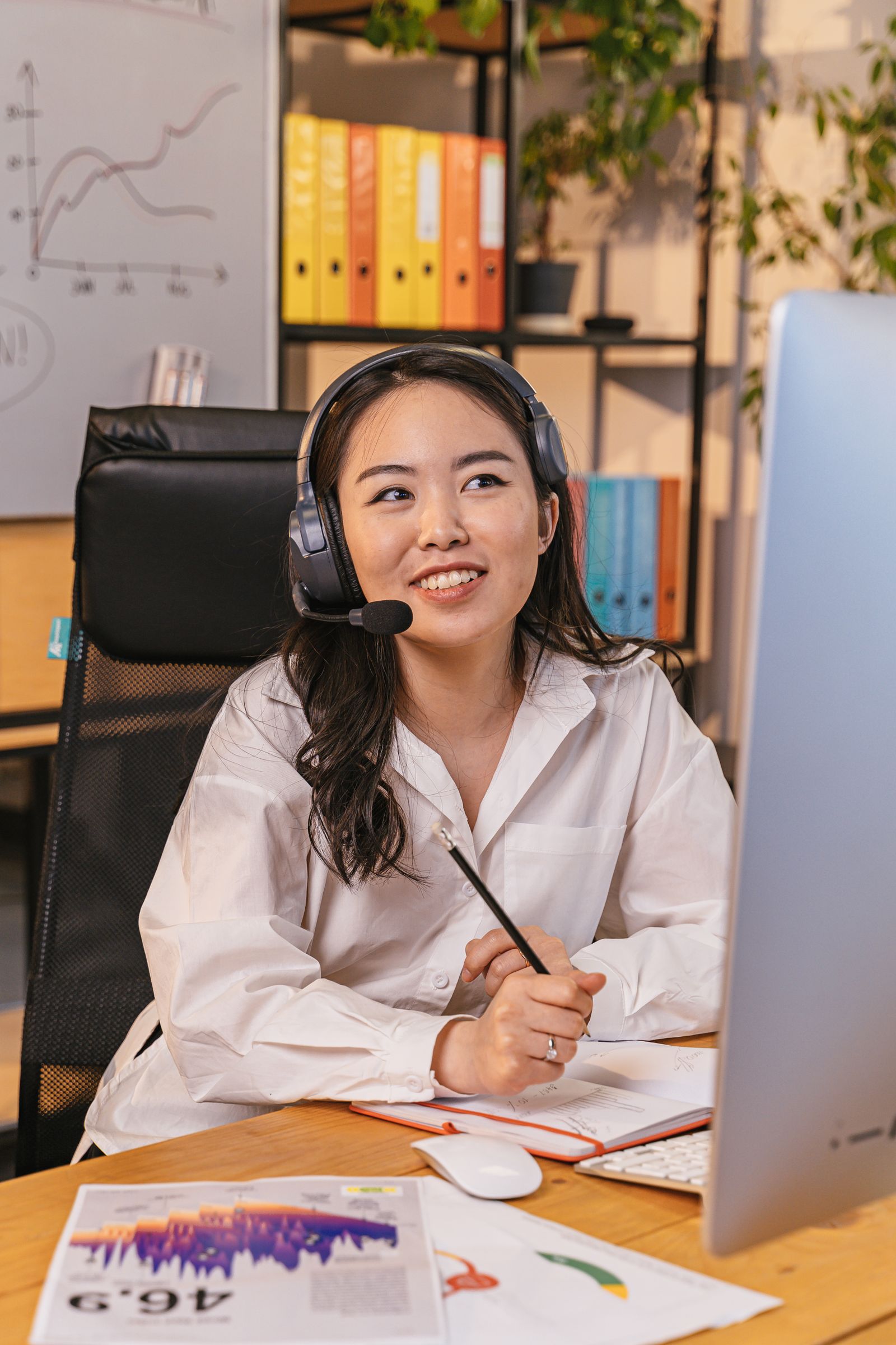 Professional handling a live phone conversation with a headset
