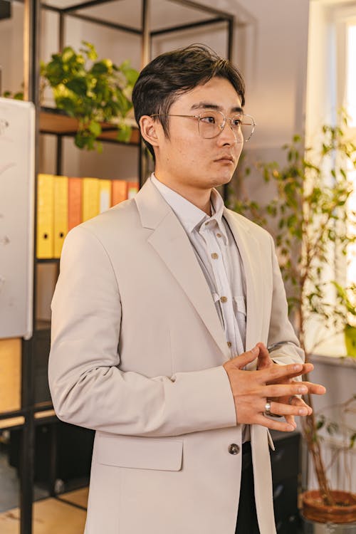 Portrait of a Man Standing in an Office