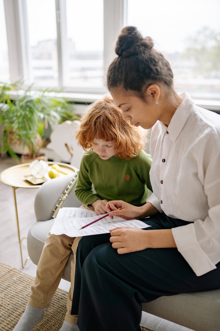 Teacher And Student Analyzing Text