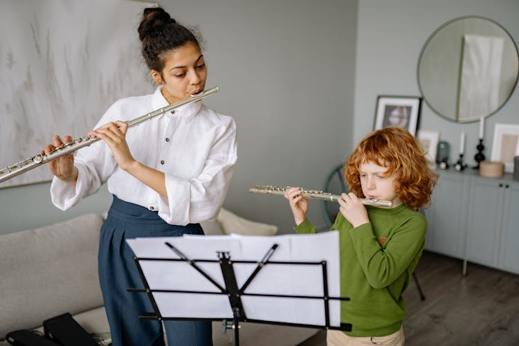 Teacher And Her Student Playing Flute