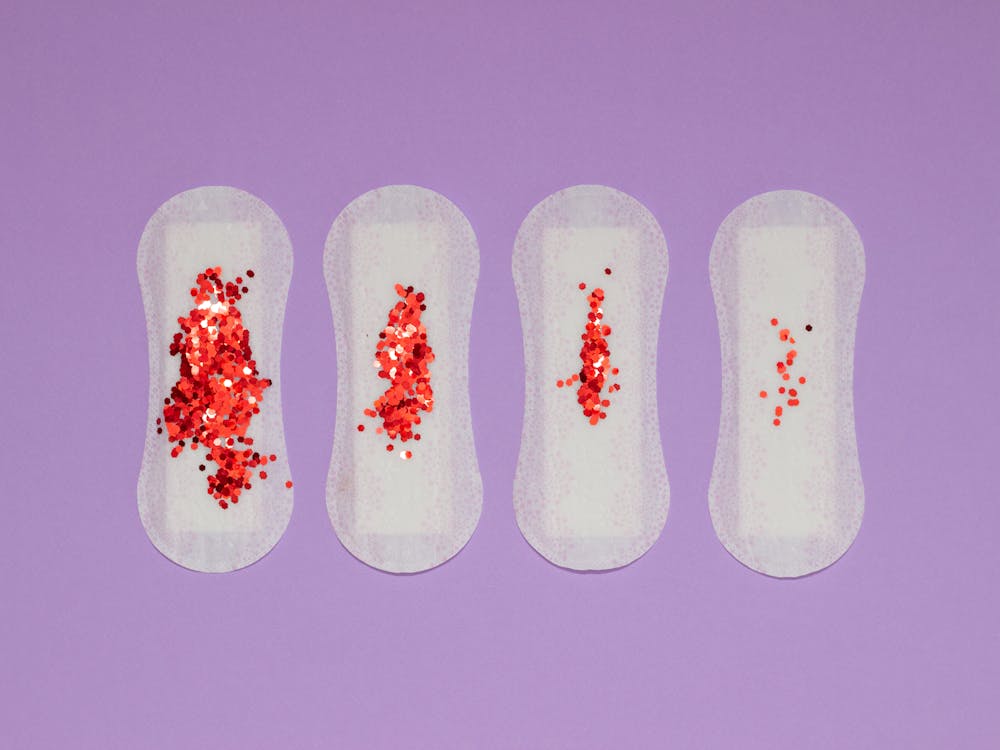  Red Sequence on Sanitary Pads on a Purple Surface