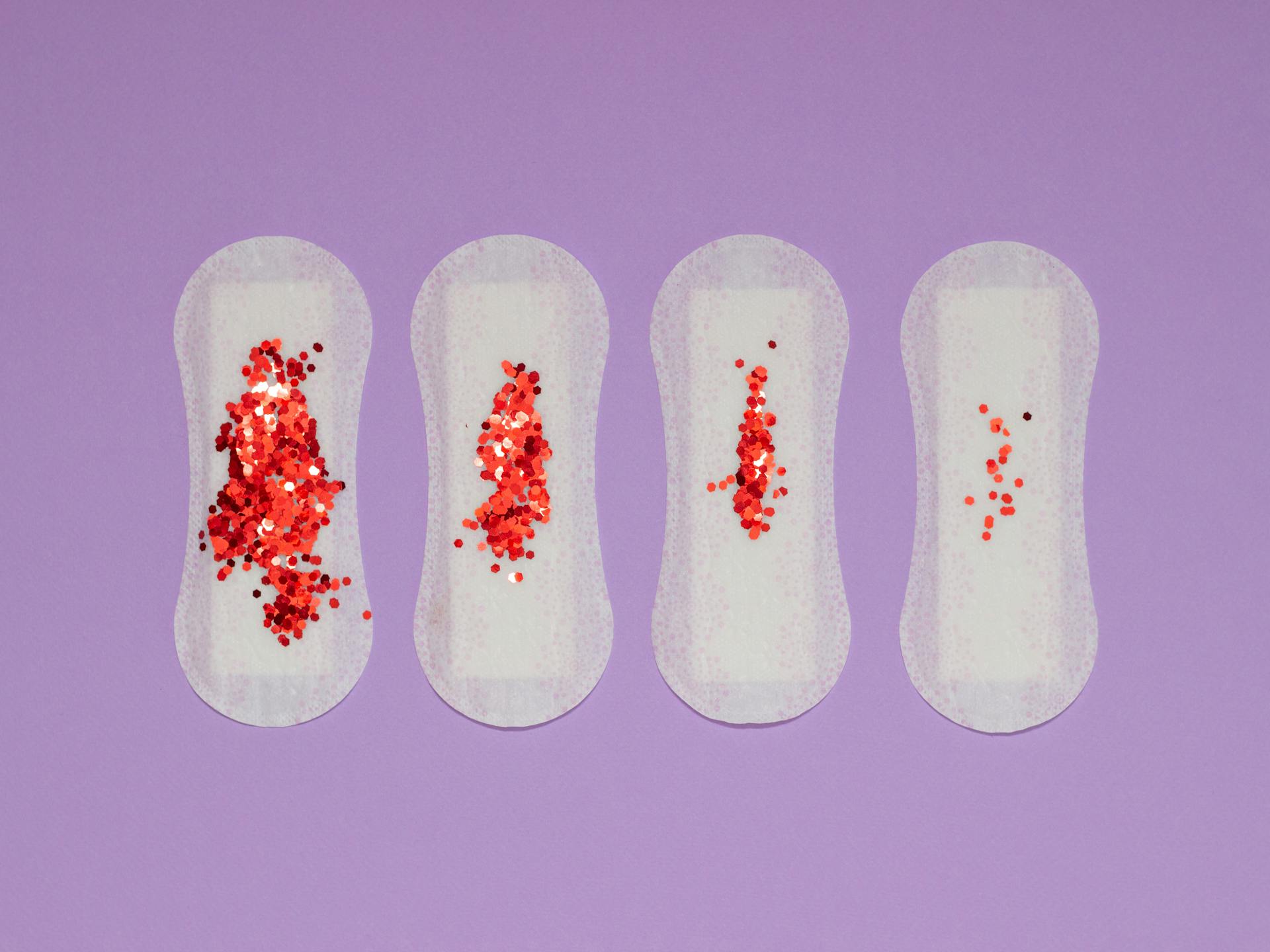 Red Sequence on Sanitary Pads on a Purple Surface