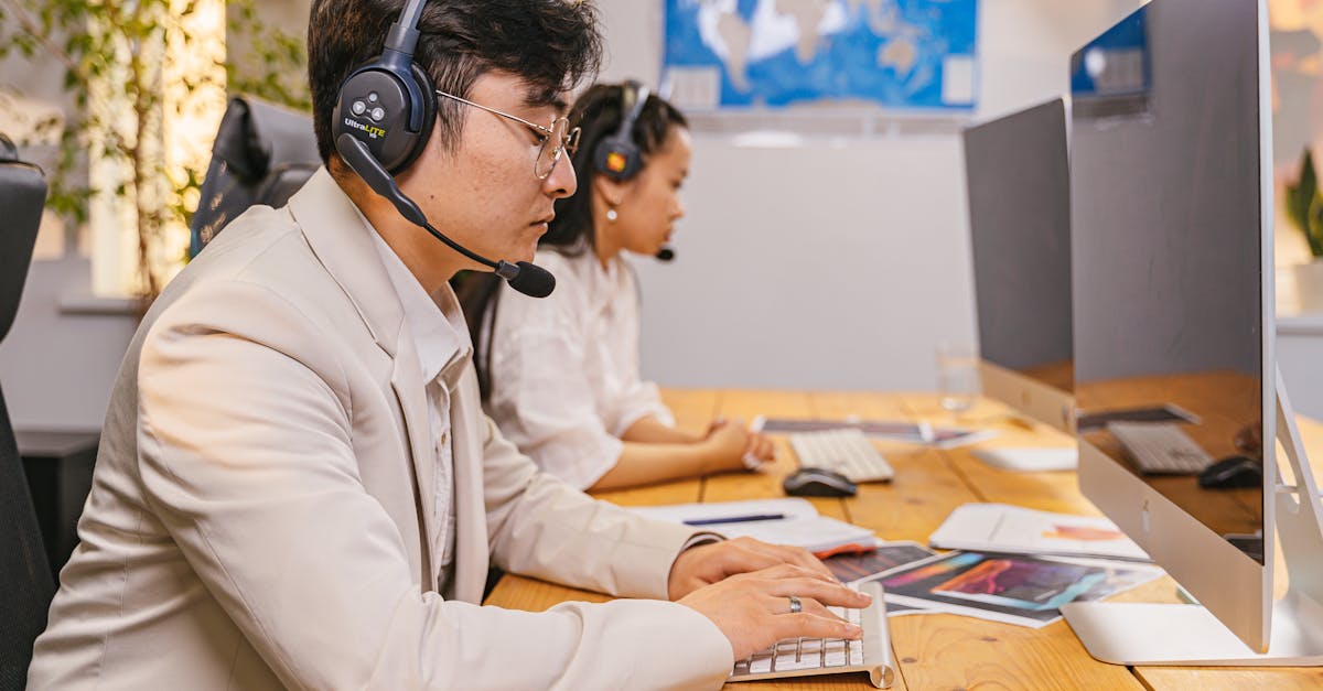 Poorly Lit Office Workspace With Isolated Desk Far From Team Members