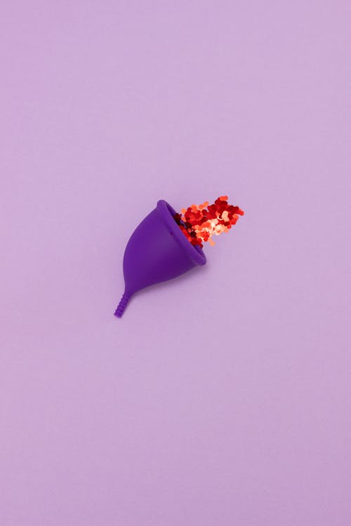 Free Red Sequins Inside the Menstrual Cup  Stock Photo