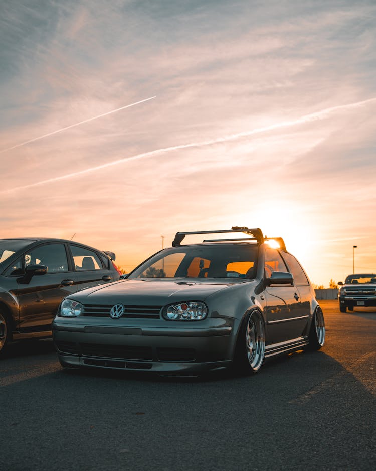 Modified Volkswagen Golf IV On A Parking Lot At Sunset 