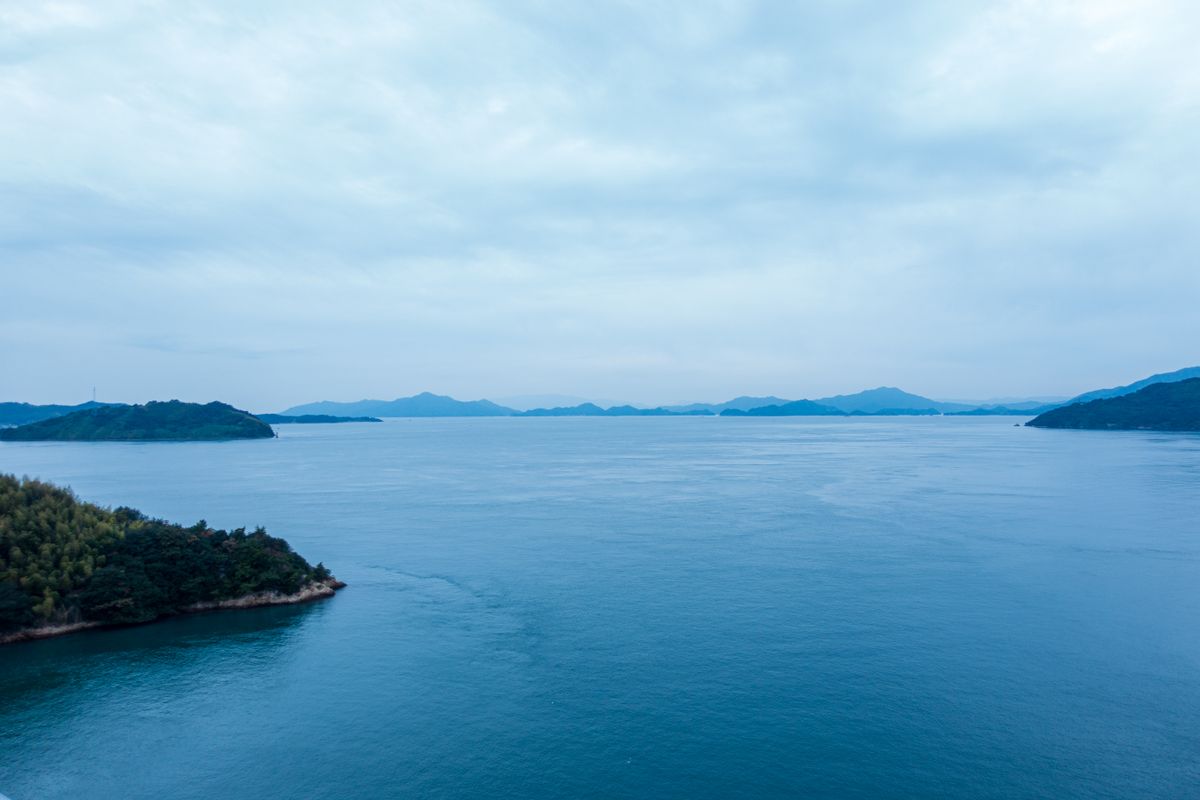 Tranquil seascape with green islands and calm bays of the Seto Inland Sea in Hiroshima Prefecture, Japan