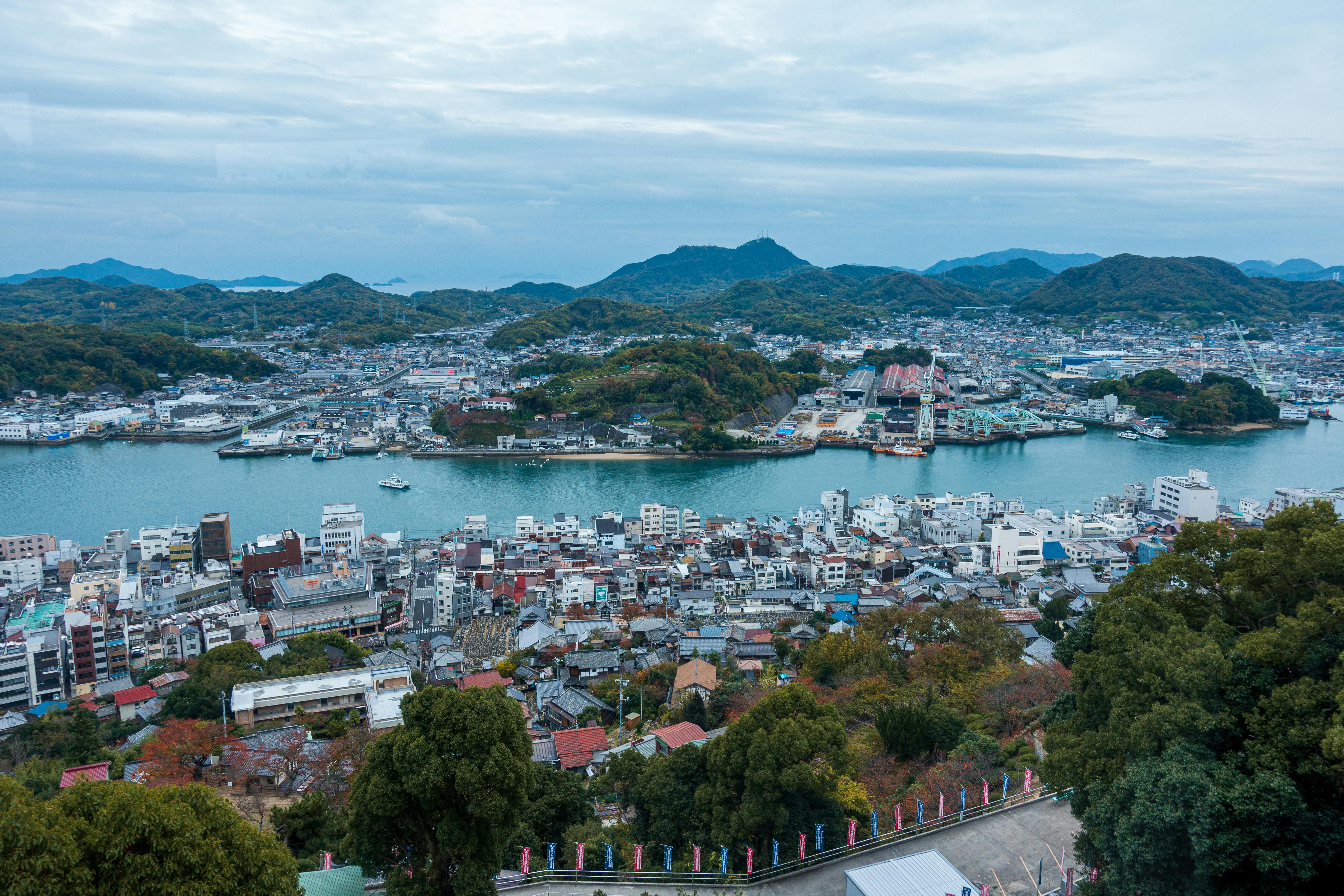 Breathtaking aerial view of Onomichi, Hiroshima Prefecture, Japan, showcasing cityscape and river.