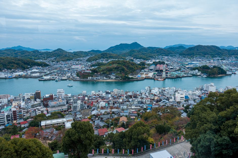 Breathtaking aerial view of Onomichi, Hiroshima Prefecture, Japan, showcasing cityscape and river.
