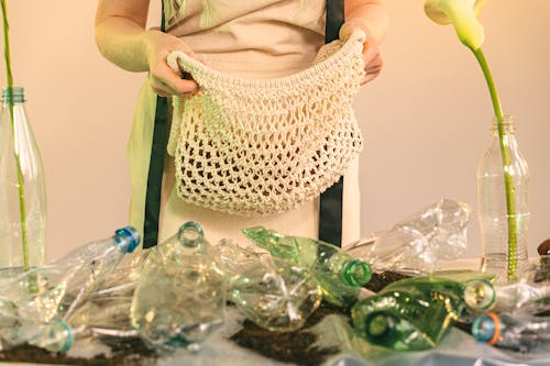 Free A Person Holding a Mesh Bag Stock Photo