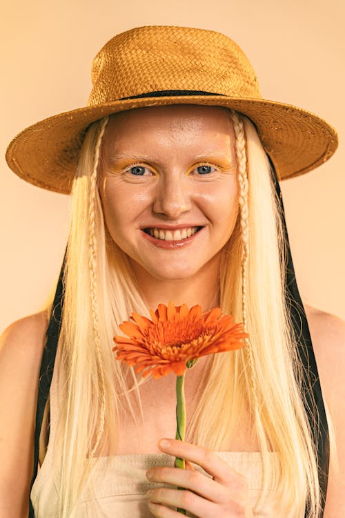 Portrait of Smiling Woman Holding Flower