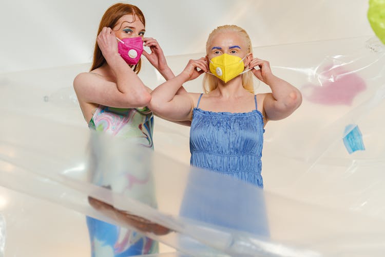 Women Surrounded With Plastics Wears Facemasks