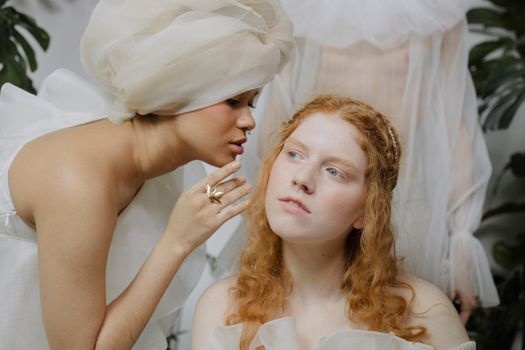 Woman in White Dress Holding White Textile