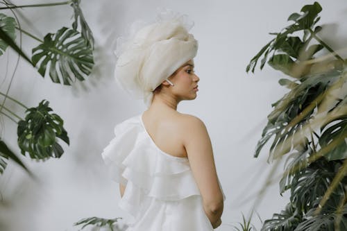 A Woman Wearing an Off Shoulder White Dress