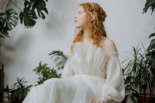 Beautiful Redhead Woman Wearing White Dress