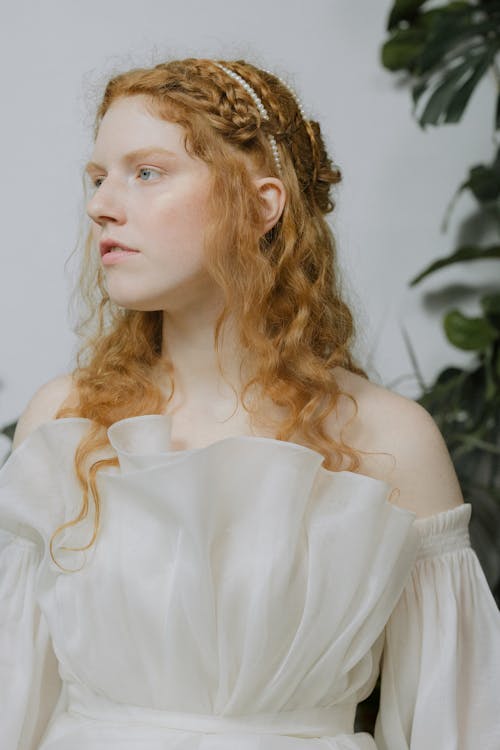 Woman in White Dress With Gold Crown