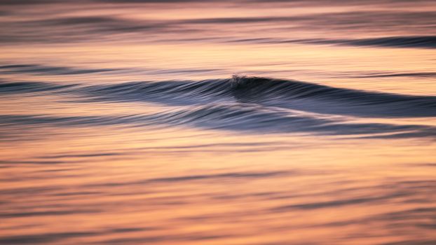 Peaceful sea waves at sunset, capturing the serene ambiance of the Polish coast.