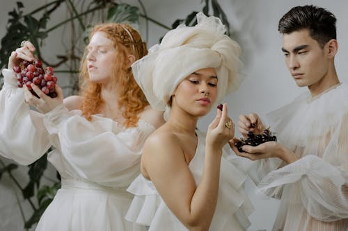 Free Man and Women in White Dresses Stock Photo