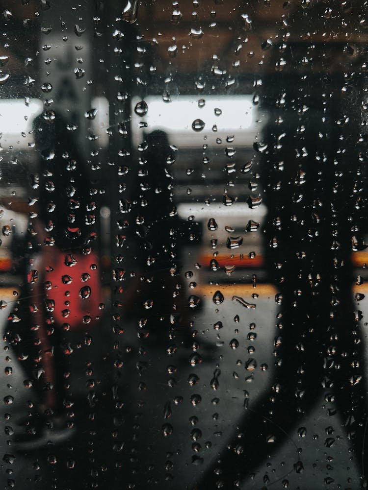 Crowd Of Tourists On Subway Through Wet Glass