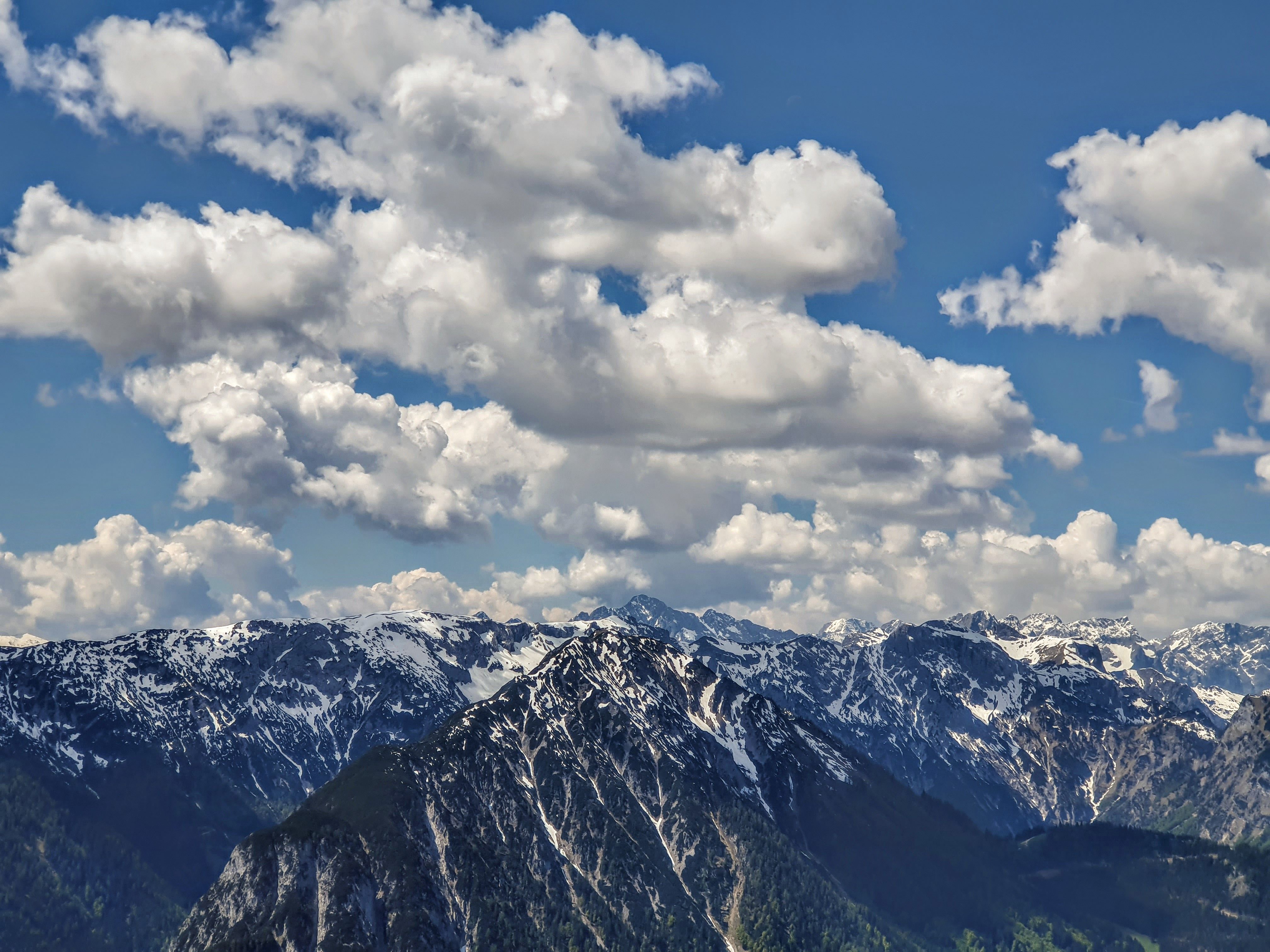 A Snow Covered Mountains Under the Blue Sky and White Clouds · Free ...