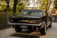 Black Ford Mustang Parked Near the Trees