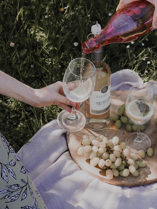 Person Pouring Wine To A Glass