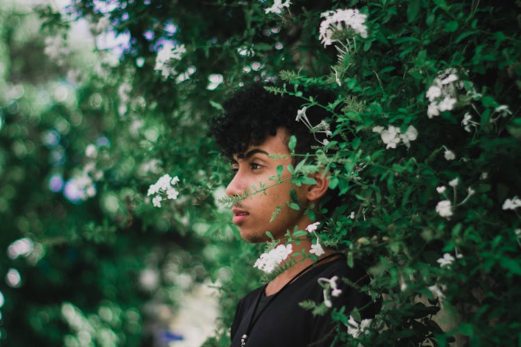 Photo Of Man Leaning On Hedge