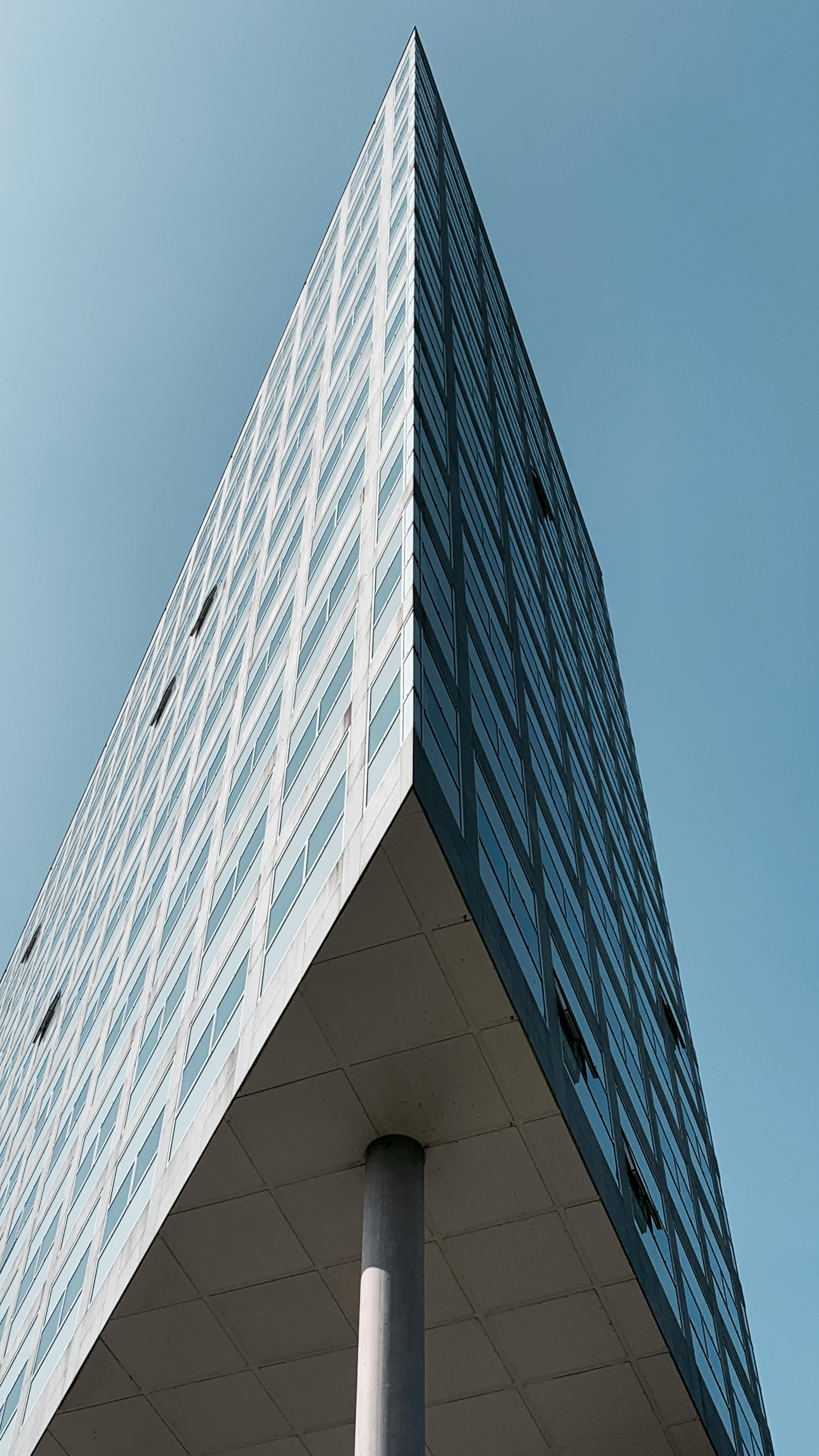 Blue Glass Walled High Rise Building · Free Stock Photo