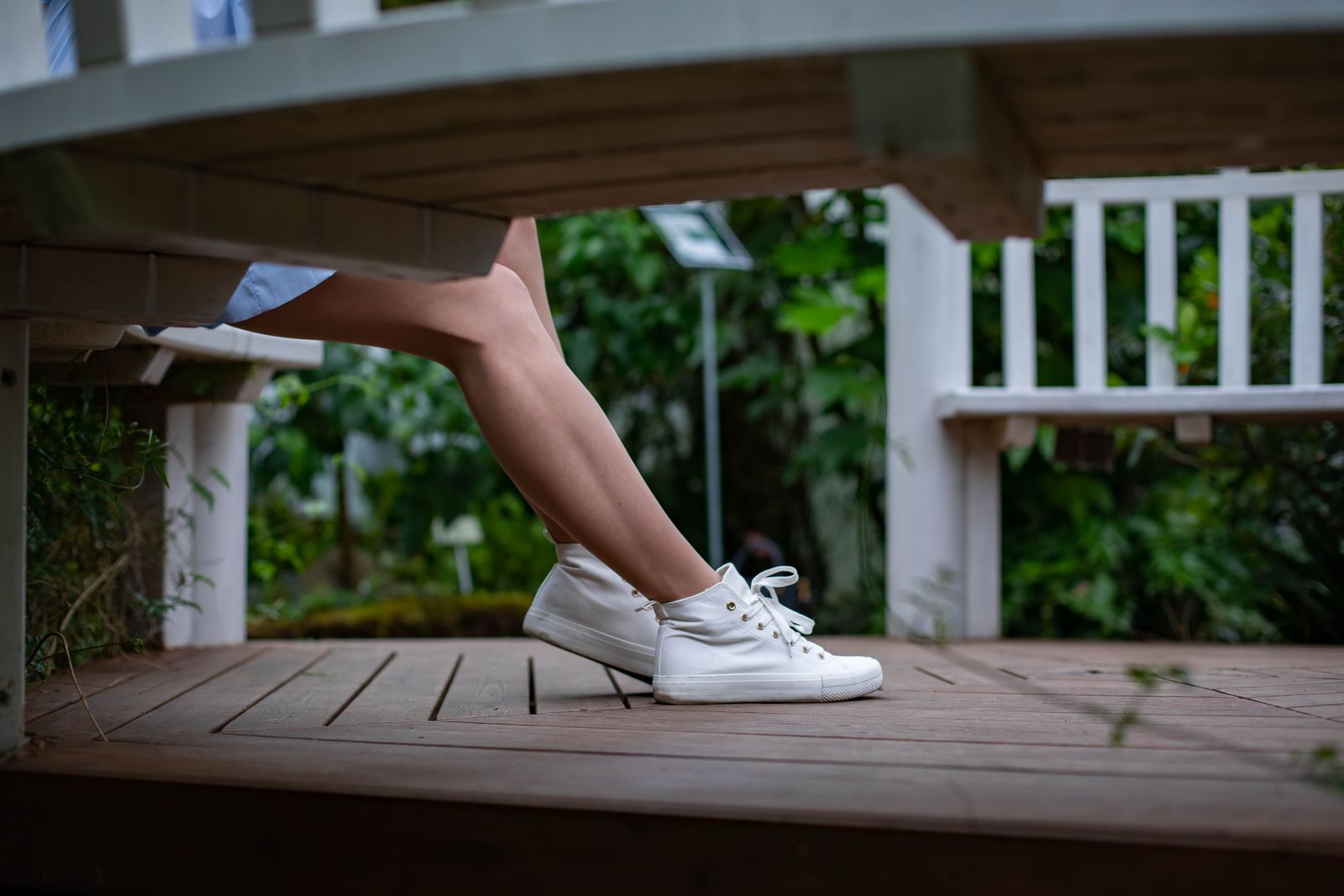 Runner stretching lower leg outdoors before choosing compression support for calf tightness