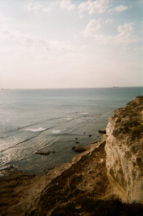 A Shore beside a Rocky Mountain