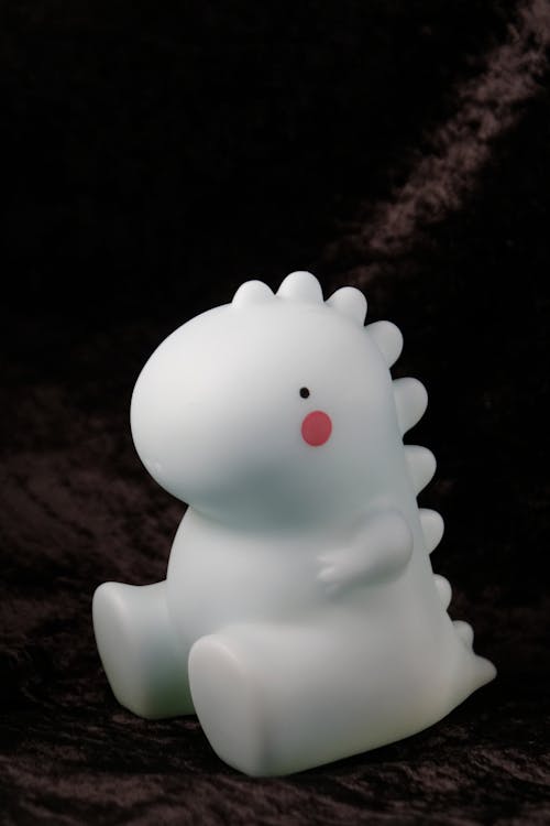 Free A White Dinosaur Toy Stock Photo