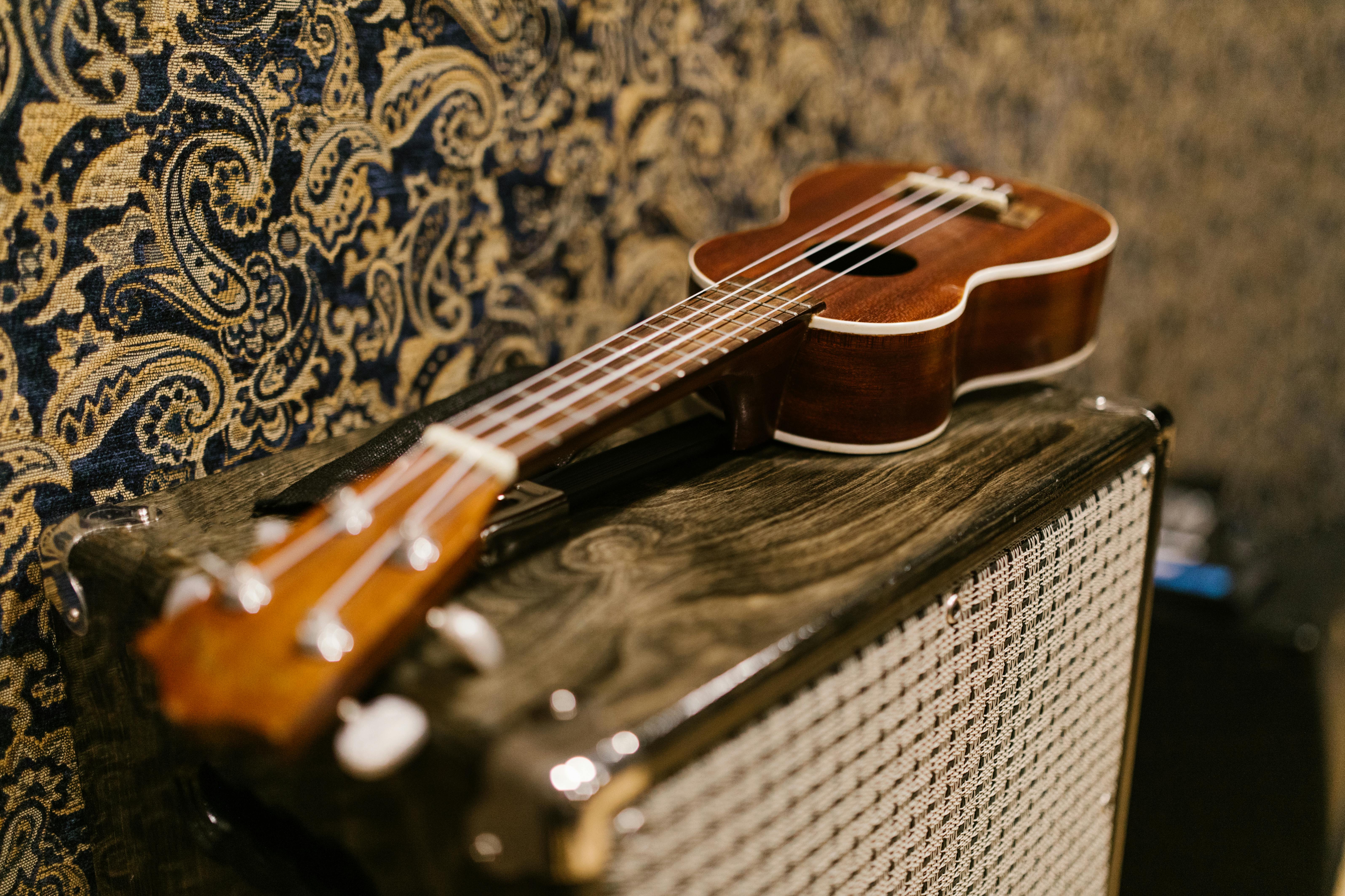 IPhone in hand, with I ❤️ Classical Ukulele wallpaper photo on screen. ( Wallpaper is my image and design Stock Photo - Alamy