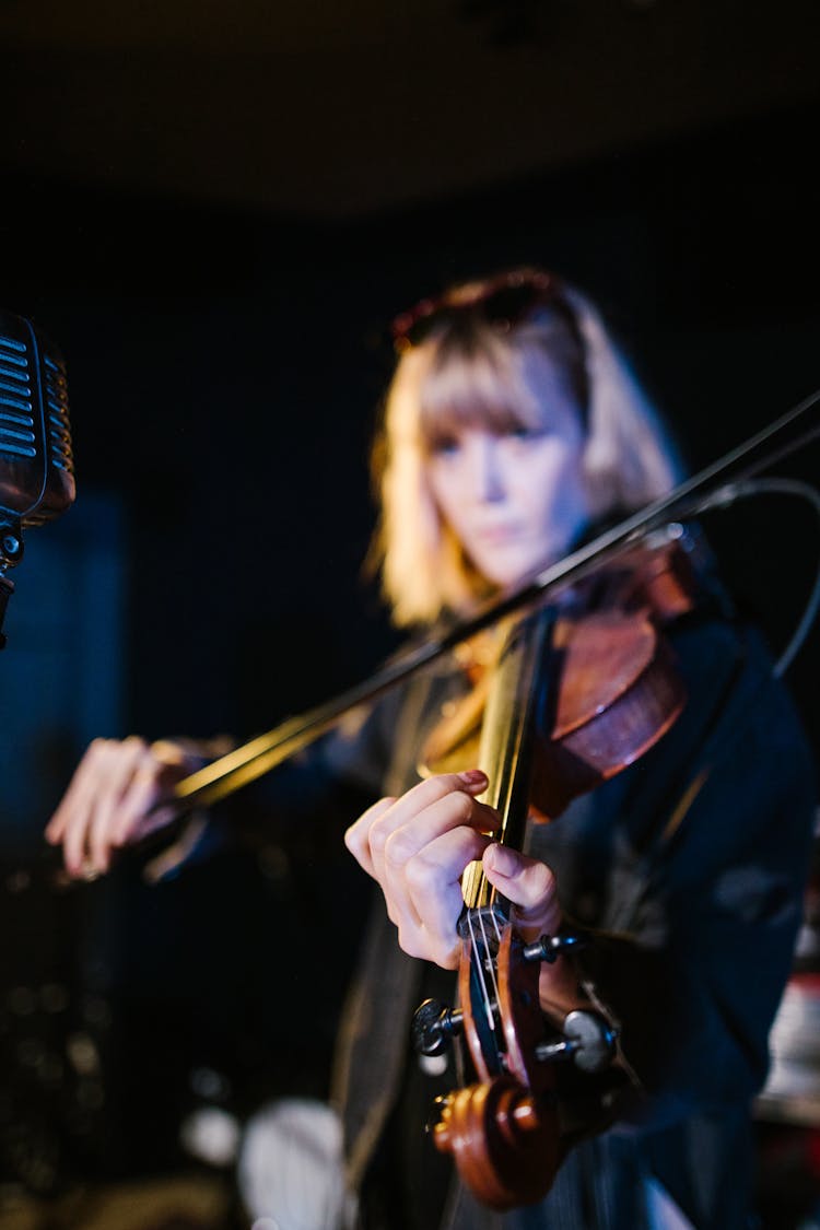 A Woman Playing The Violin