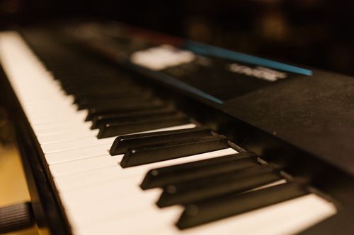 Free Detailed close-up of piano keys on an electronic keyboard. Perfect for music-related content. Stock Photo
