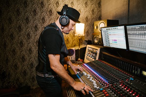 Free Man Working inside a Recording Studio Stock Photo