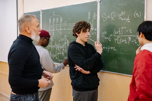 A Man Writing on the Blackboard