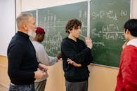 A Man Writing on the Blackboard
