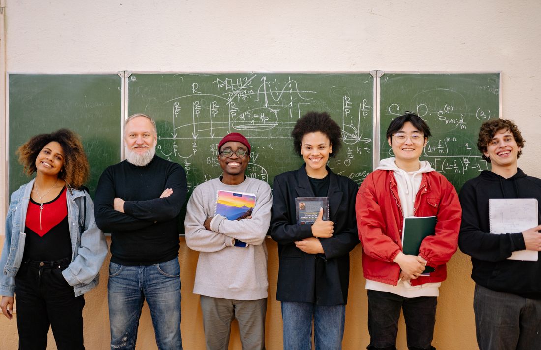 Teacher and students smiling together at Ashgrove School Trust — photo by Yan Krukau on Pexels