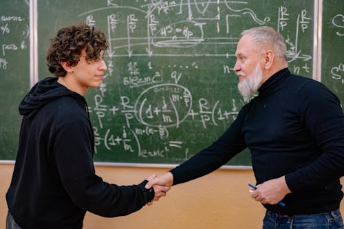 Professor and a Student Shaking Hands